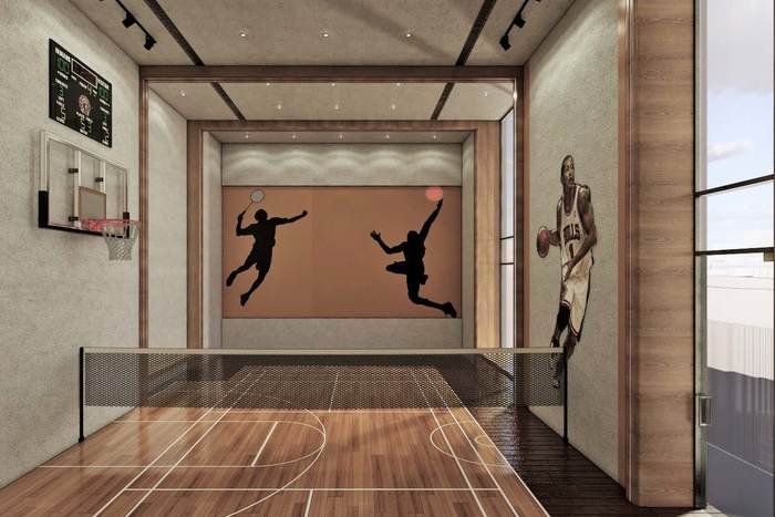 Indoor multi-purpose court marked for badminton and basketball at Acasa