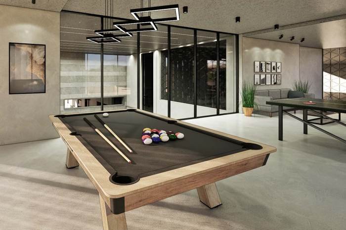 Indoor games room with pool and table tennis tables at Acasa