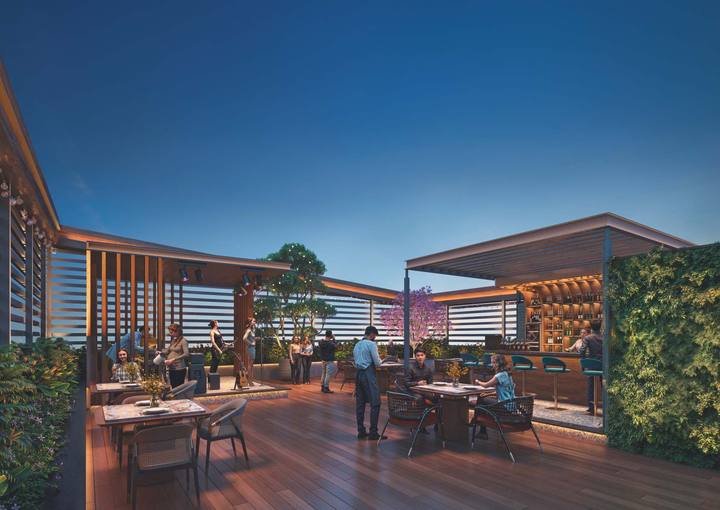 Rooftop terrace lounge and dining deck at AVR Evania, Kokapet
