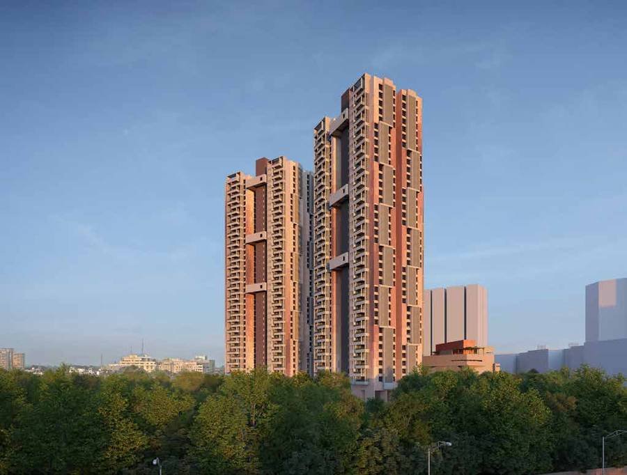 The towers of Myscape Songs of the Sun at golden hour, showing the terracotta and sandstone façade banding.