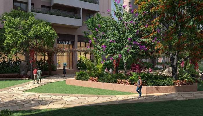 The café at Myscape Songs of the Sun, opening onto the central landscape with outdoor seating.