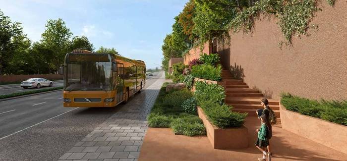 The separate pedestrian entry at the lower road level of Myscape Songs of the Sun, with the bus shelter alongside and the children's play area on the level above.