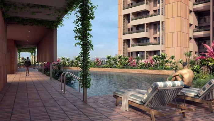 The terrace swimming pool at Myscape Songs of the Sun, with Deccan rock, planters and terracotta flooring.