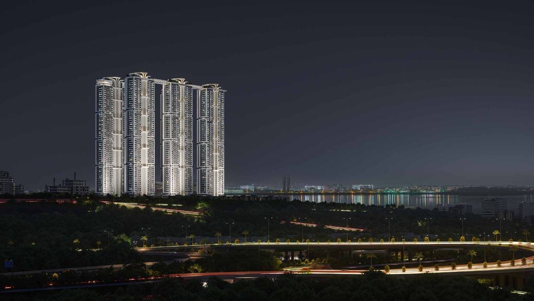 One by MSN lit at night above the lake at Neopolis, Hyderabad, seen from the Outer Ring Road