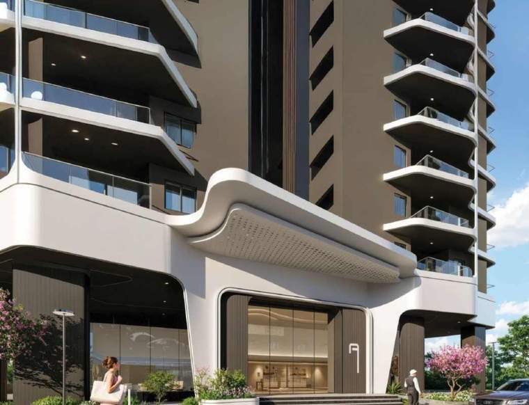 Double-height tower entrance lounge and stilt-level amenity deck at Rajapushpa Skyra, Kokapet.