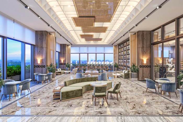 Double-height library and lounge in the base clubhouse at Skyven Kokapet